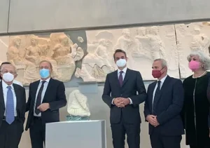 People viewing cultural exhibits at a museum