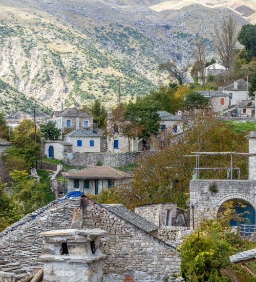 Traditional stone village in Epirus surrounded by mountains and trees