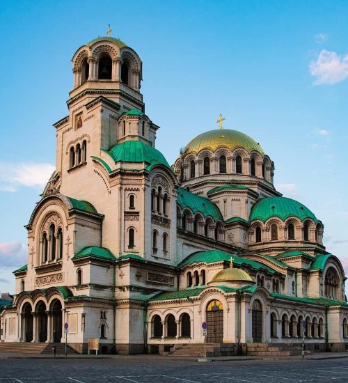 Historic Bulgarian Orthodox cathedral with green domes and towers